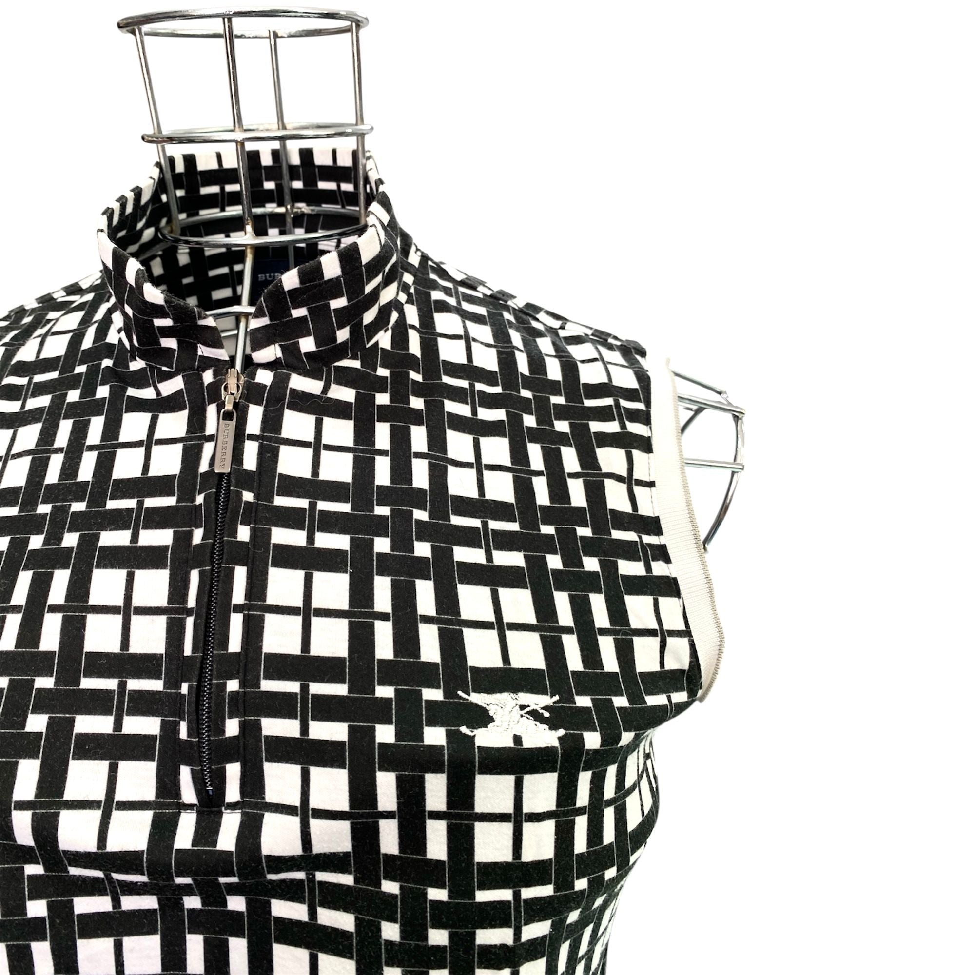 Maglia smanicata collo alto con chiusura zip