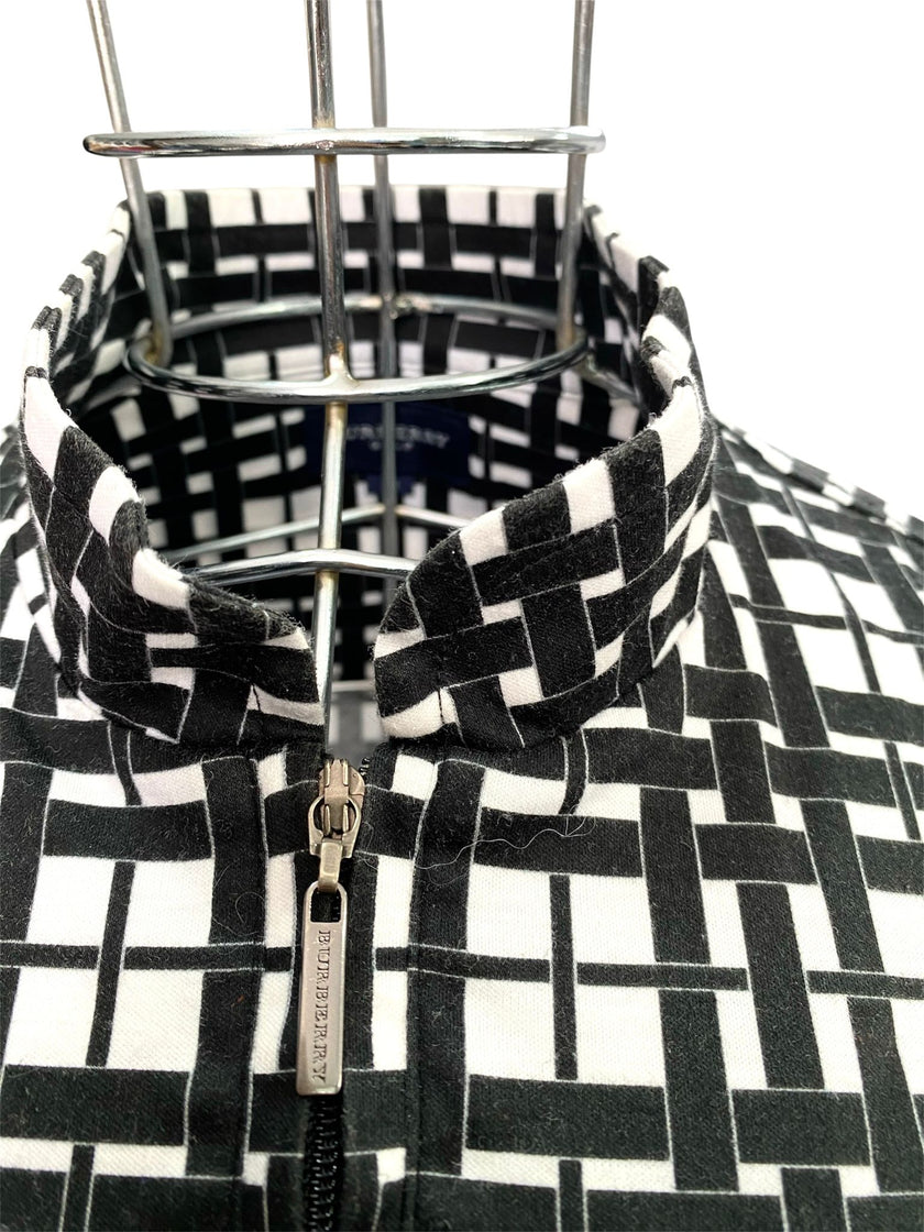 Maglia smanicata collo alto con chiusura zip