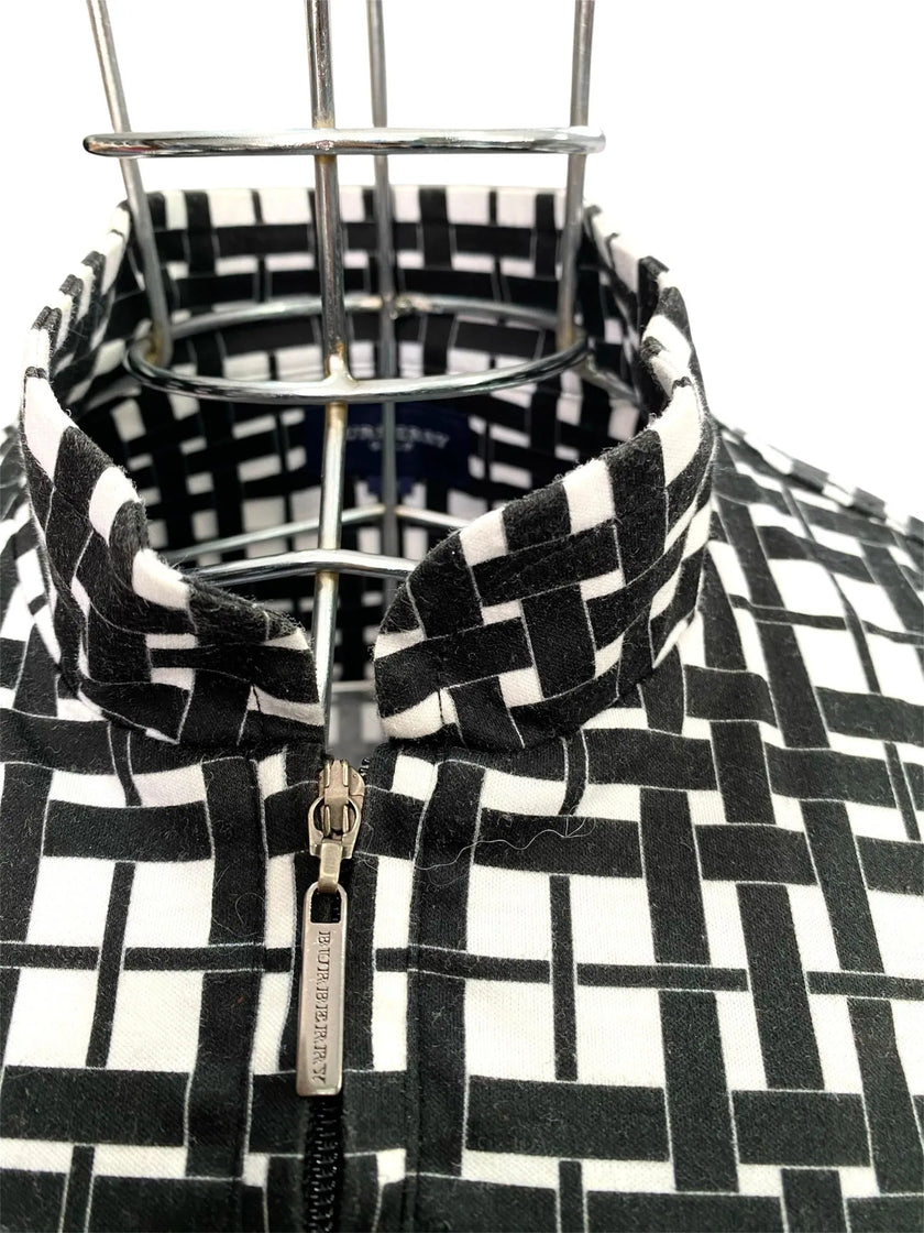 Maglia smanicata collo alto con chiusura zip
