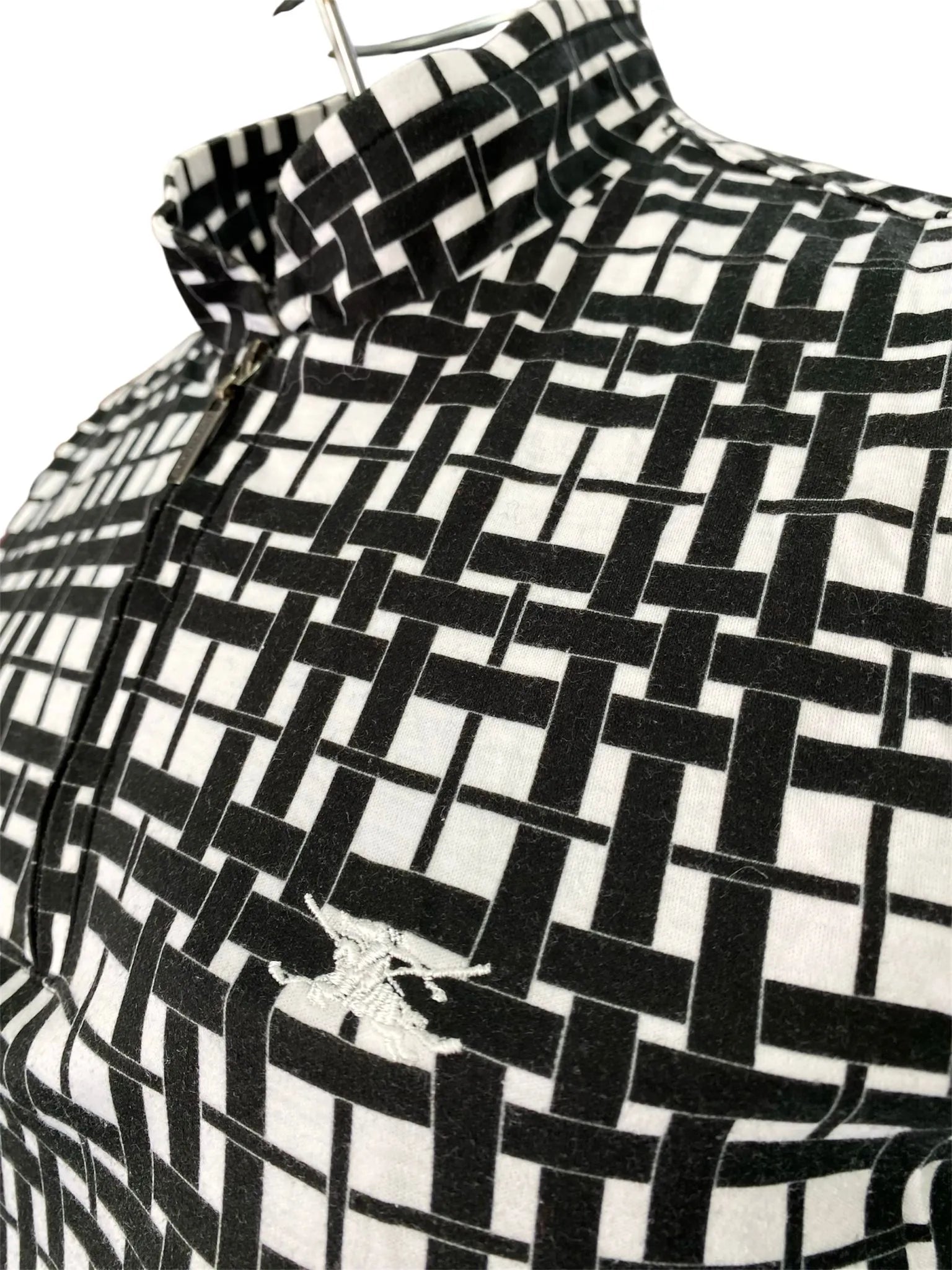 Maglia smanicata collo alto con chiusura zip