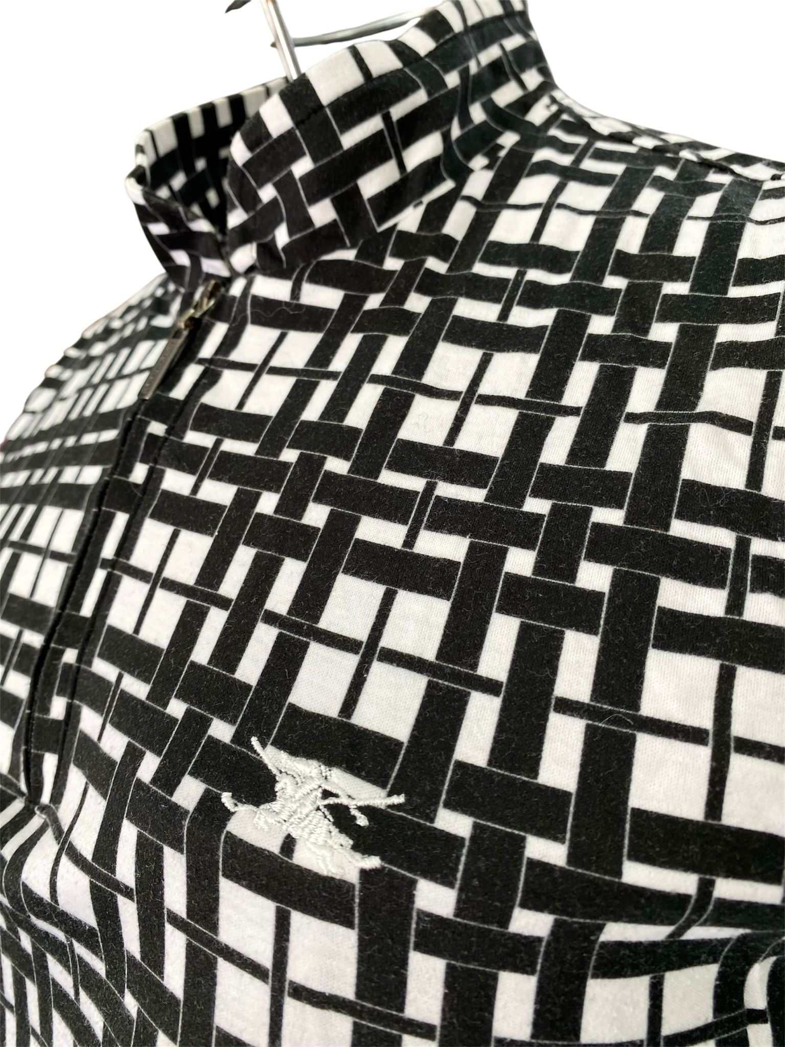 Maglia smanicata collo alto con chiusura zip