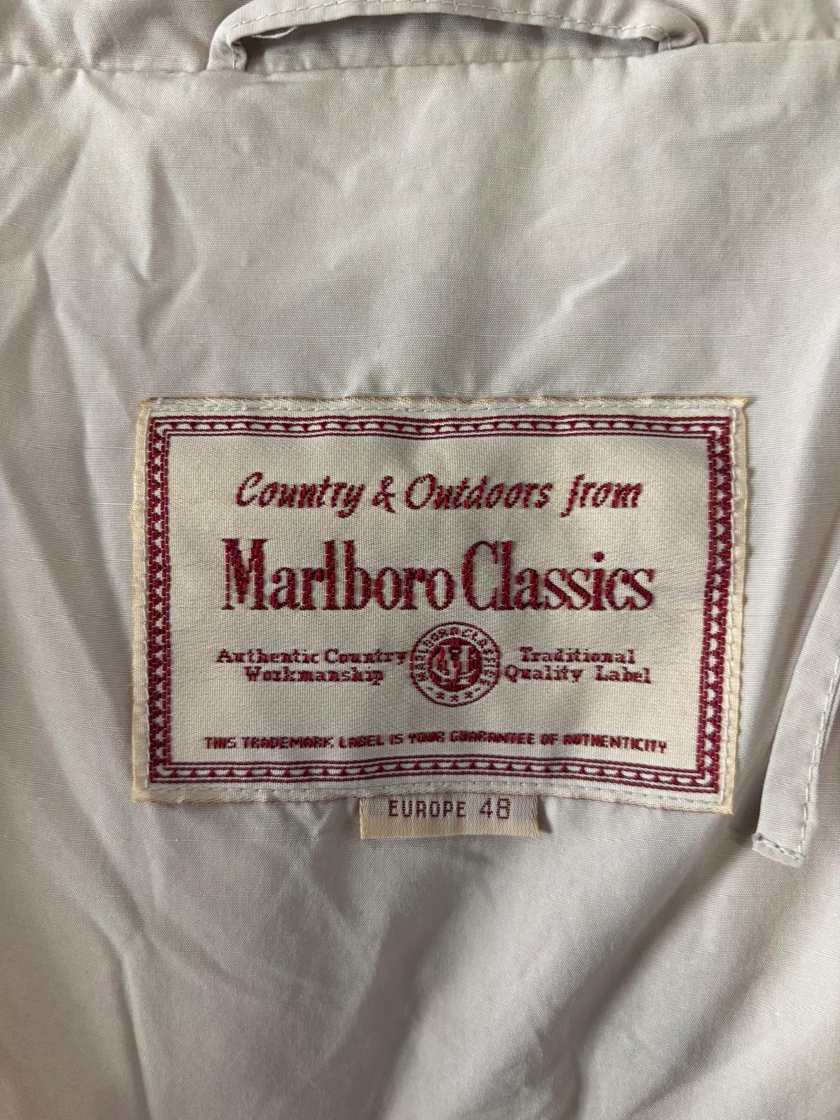 Piumino con collo alto e con tasche nascoste MARLBORO