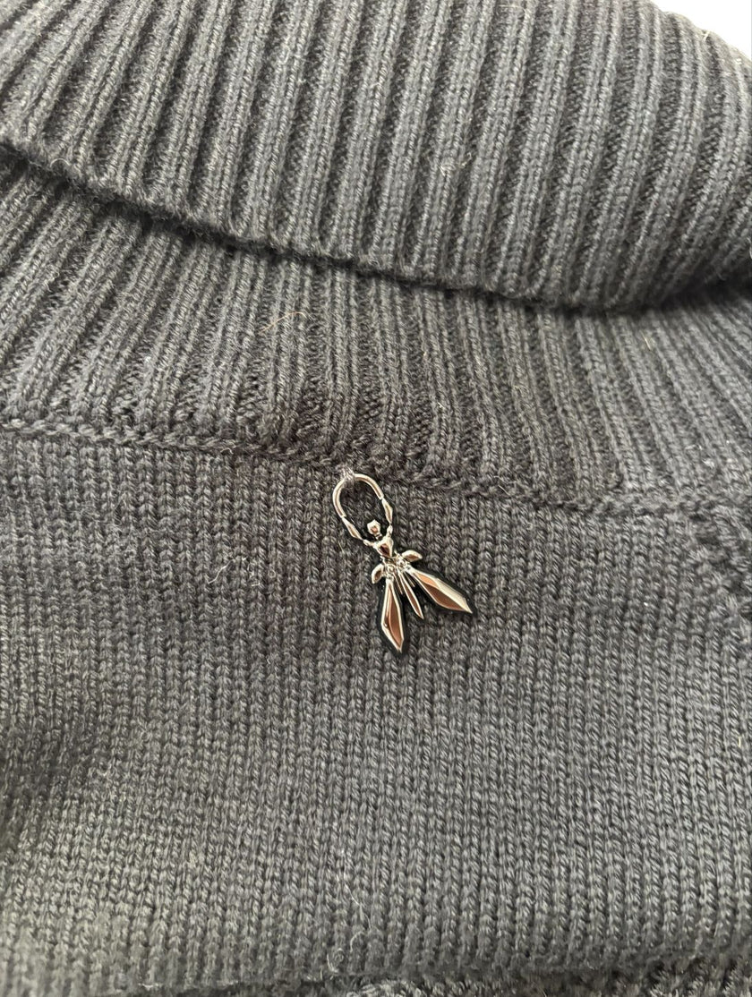 Maglia dolcevita con motivo intrecciato sulle maniche e con bordo e collo a costine