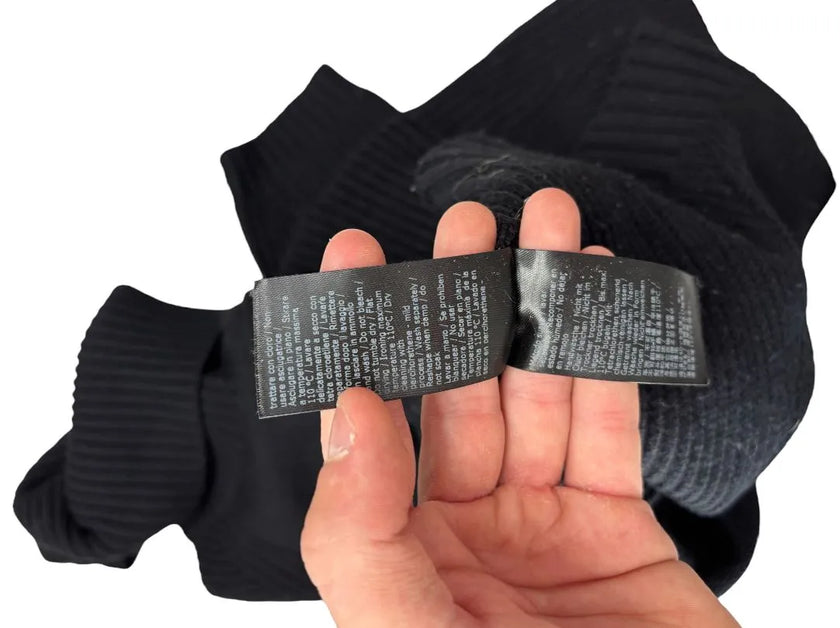 Maglia dolcevita con motivo intrecciato sulle maniche e con bordo e collo a costine