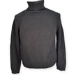 Maglia dolcevita con motivo intrecciato sulle maniche e con bordo e collo a costine