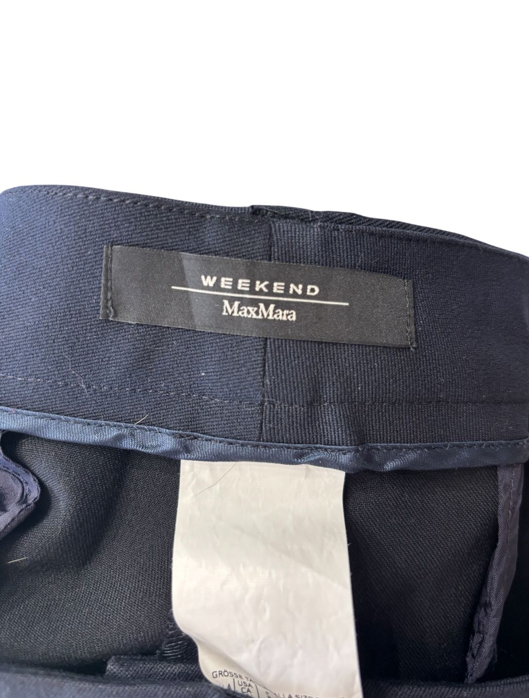 Pantaloni eleganti vita taglio dritto con chiusura decentrata con bottone