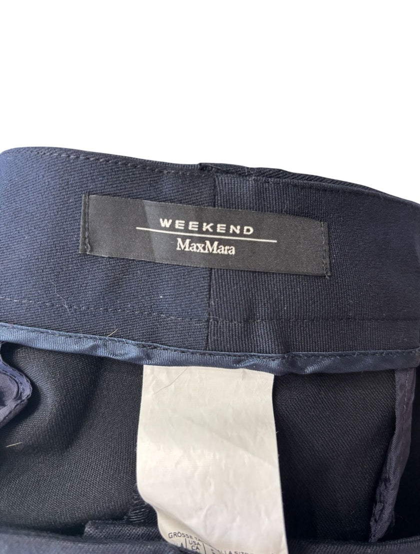 Pantaloni eleganti vita taglio dritto con chiusura decentrata con bottone