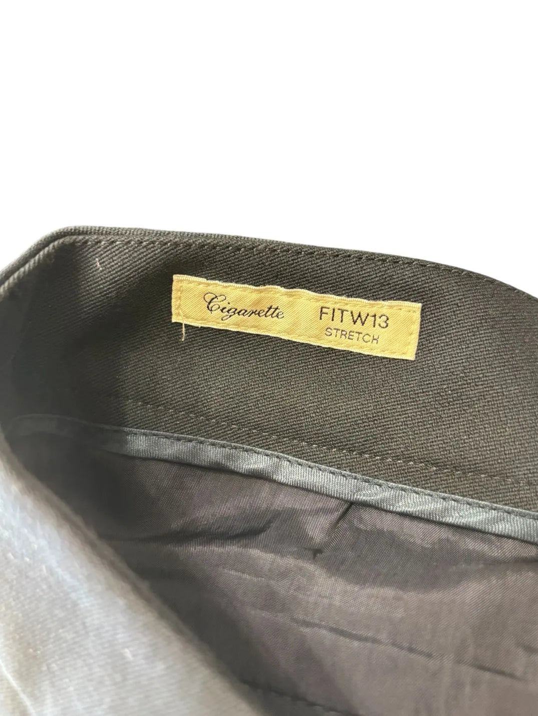 Pantaloni eleganti vita taglio dritto con chiusura decentrata con bottone