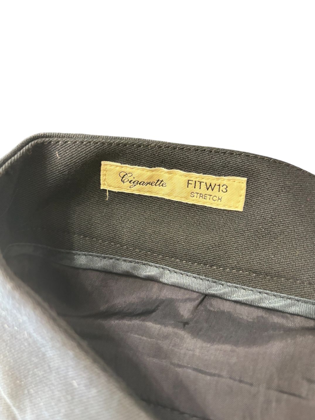 Pantaloni eleganti vita taglio dritto con chiusura decentrata con bottone