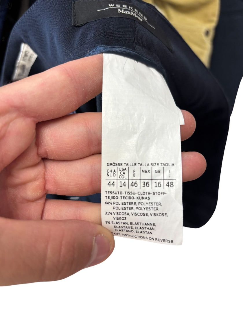 Pantaloni eleganti vita taglio dritto con chiusura decentrata con bottone