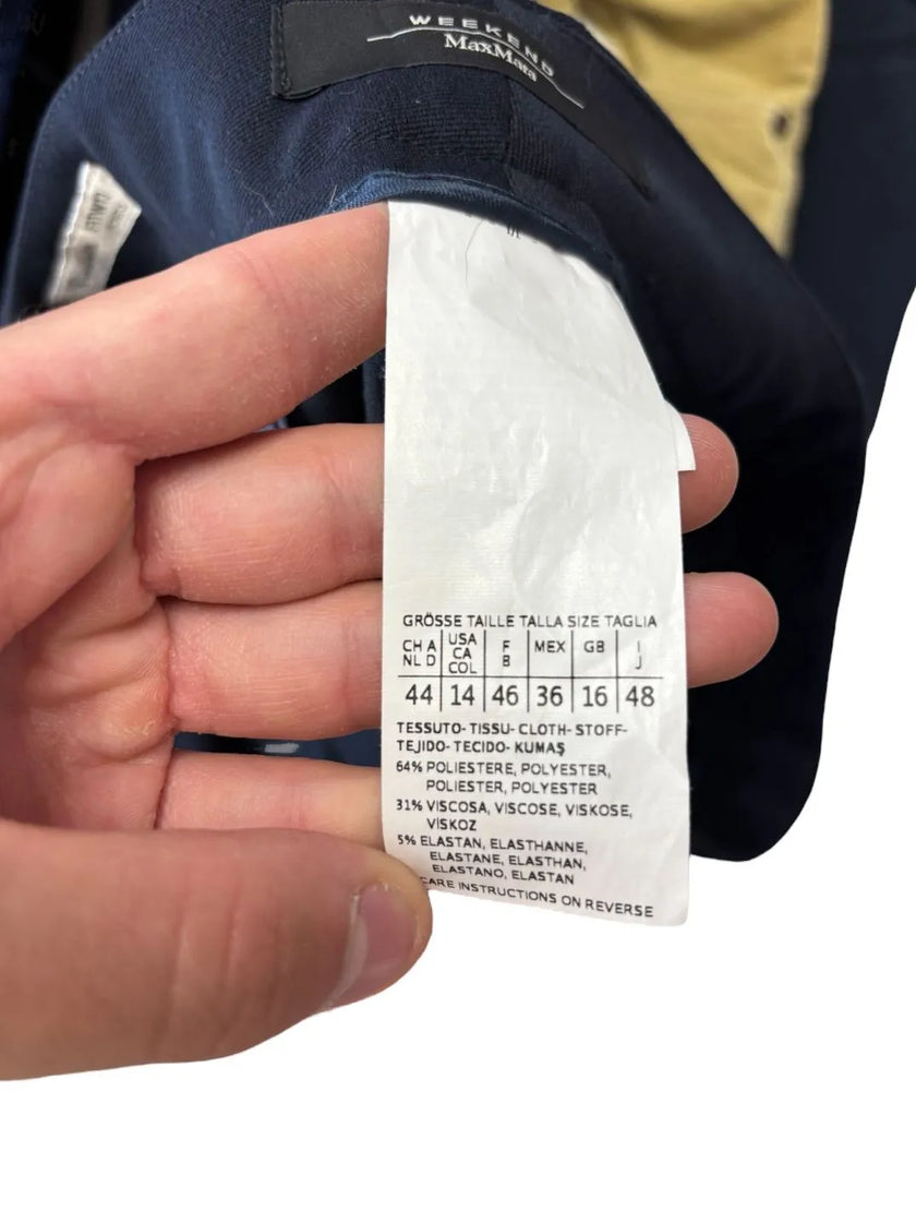 Pantaloni eleganti vita taglio dritto con chiusura decentrata con bottone
