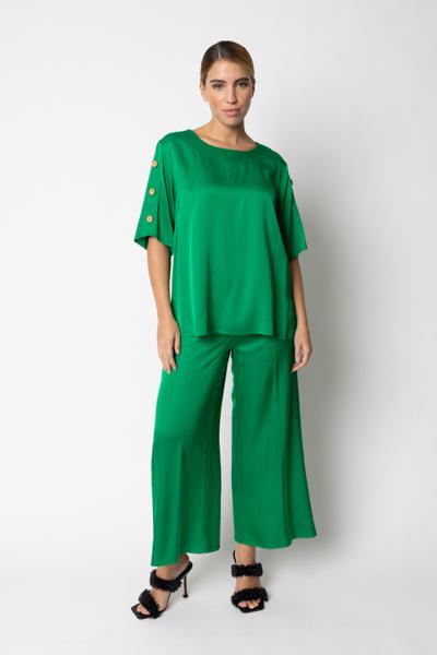 Blusa con bottoni laterali