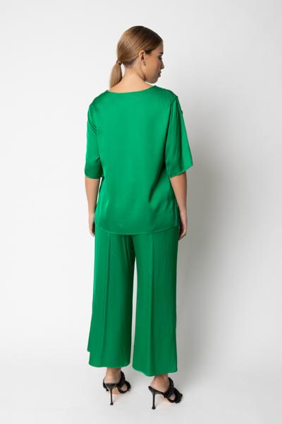 Blusa con bottoni laterali